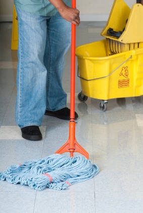 Superior Cleaning Solutions janitor in Lake Edwards, MN mopping floor.